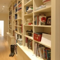 Large hallway library with storage cupboards - view 1